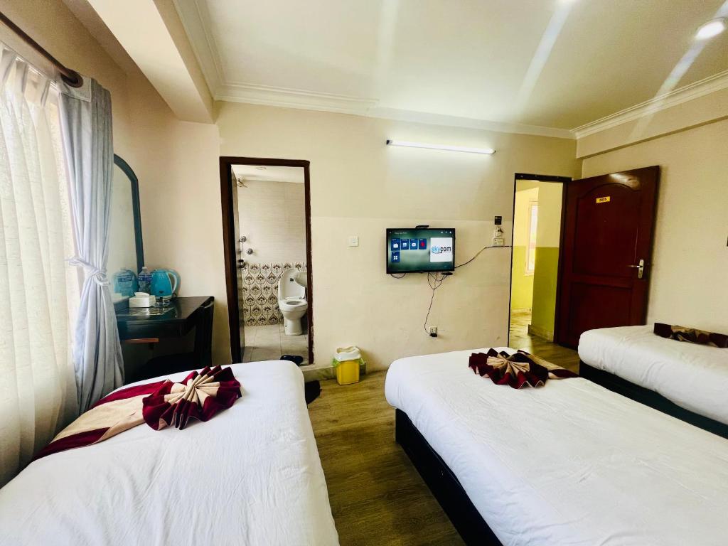 Postel nebo postele na pokoji v ubytování Hotel Liv Inn