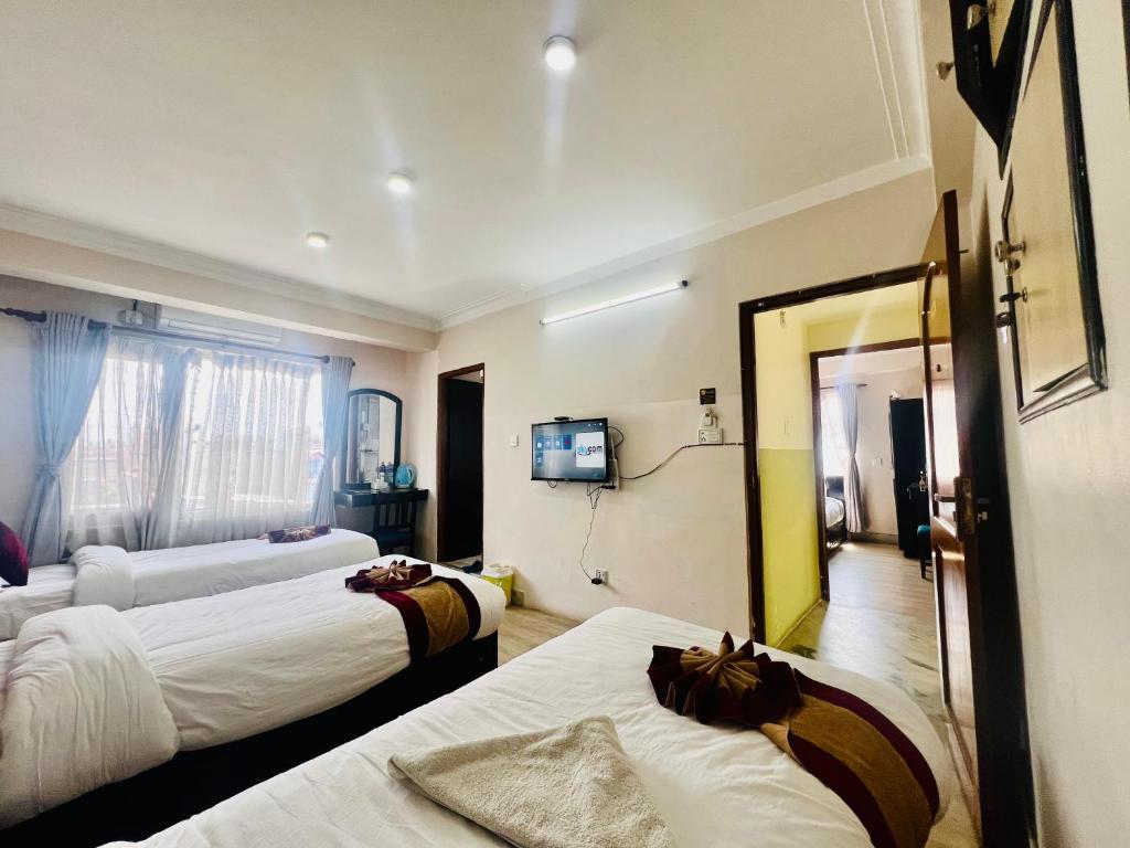 Postel nebo postele na pokoji v ubytování Hotel Liv Inn