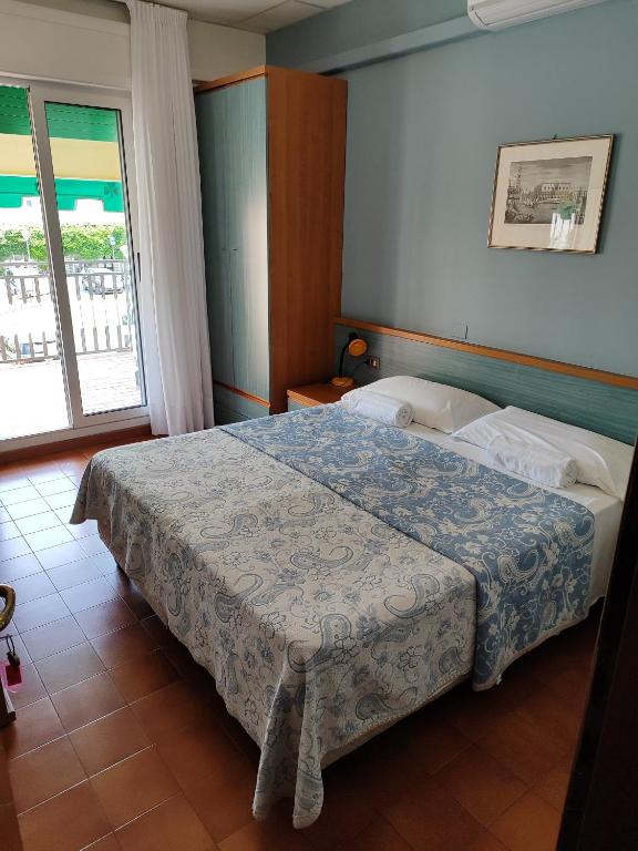 Postel nebo postele na pokoji v ubytování Hotel Trifoglio