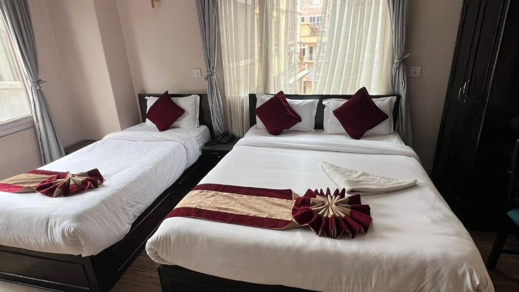 Postel nebo postele na pokoji v ubytování Hotel Liv Inn