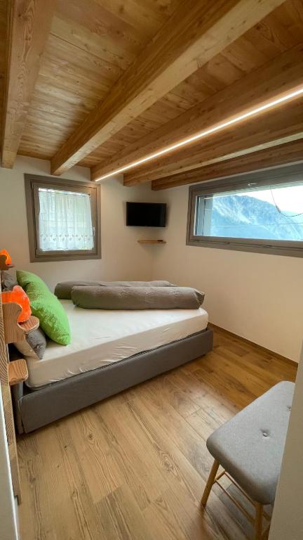 Postel nebo postele na pokoji v ubytování beb Aria di Montagna