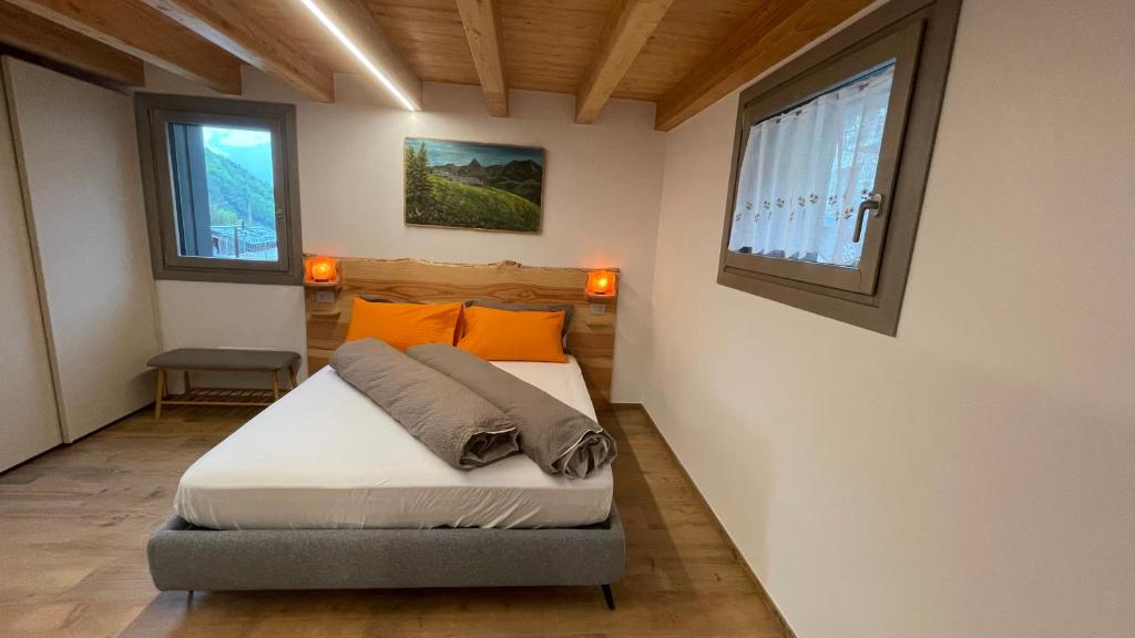 Postel nebo postele na pokoji v ubytování beb Aria di Montagna