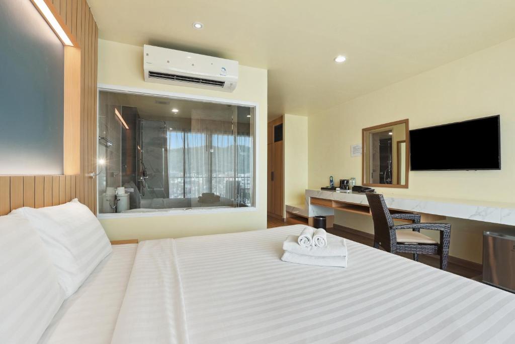 Postel nebo postele na pokoji v ubytování Dome Kata Resort