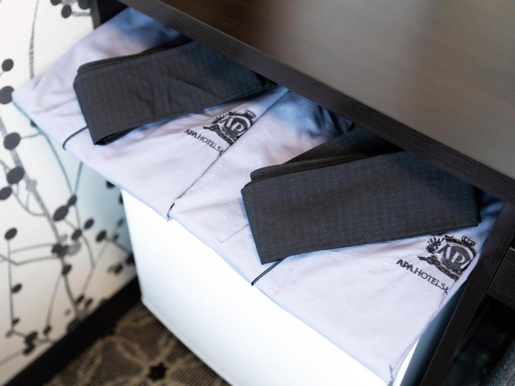Postel nebo postele na pokoji v ubytování APA Hotel Hiroshima Ekimae Shinkansenguchi