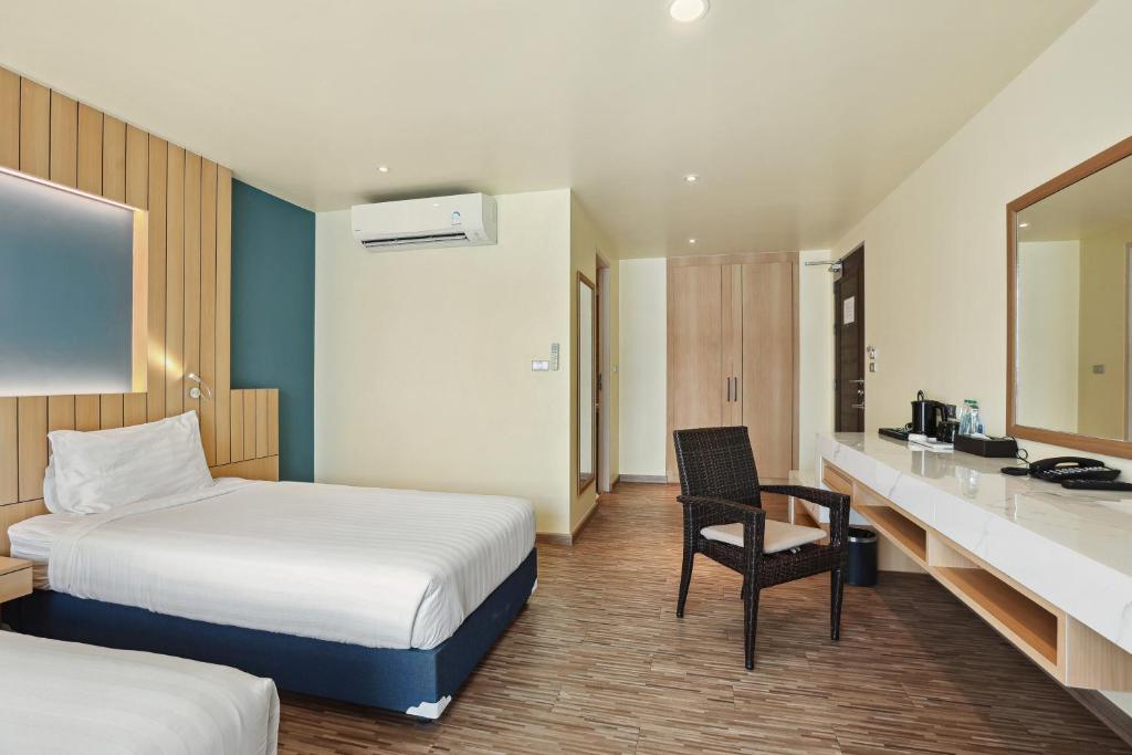 Postel nebo postele na pokoji v ubytování Dome Kata Resort