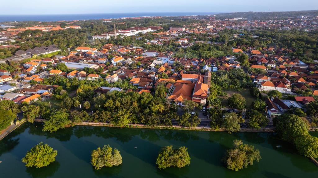 an aerial view of a city with a lake at Bali Sunshine Nusa Dua in Nusa Dua