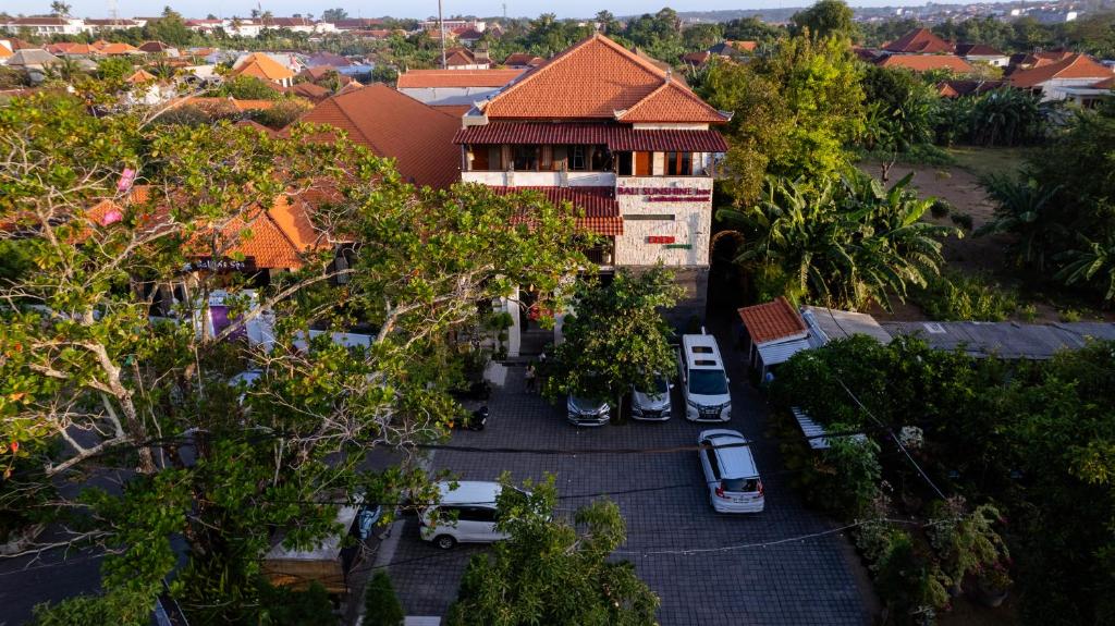 an overhead view of a building with cars parked in a parking lot at Bali Sunshine Nusa Dua in Nusa Dua