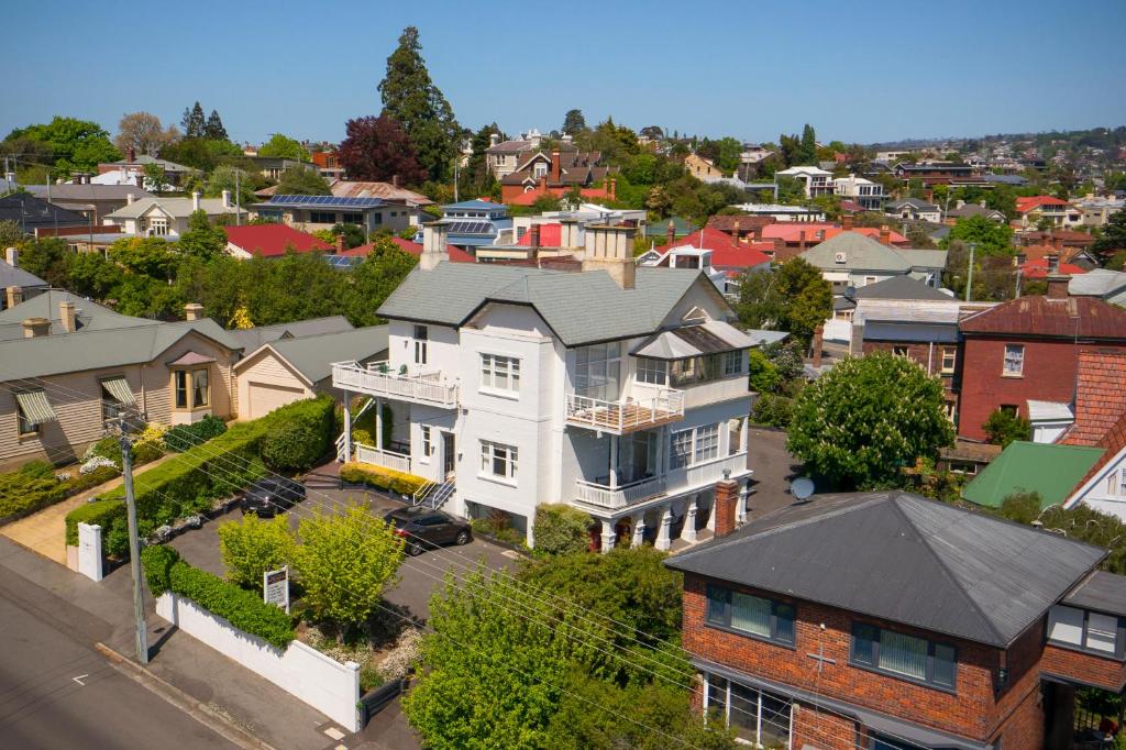 an aerial view of a large house in a city at Highbury Apartments in Launceston