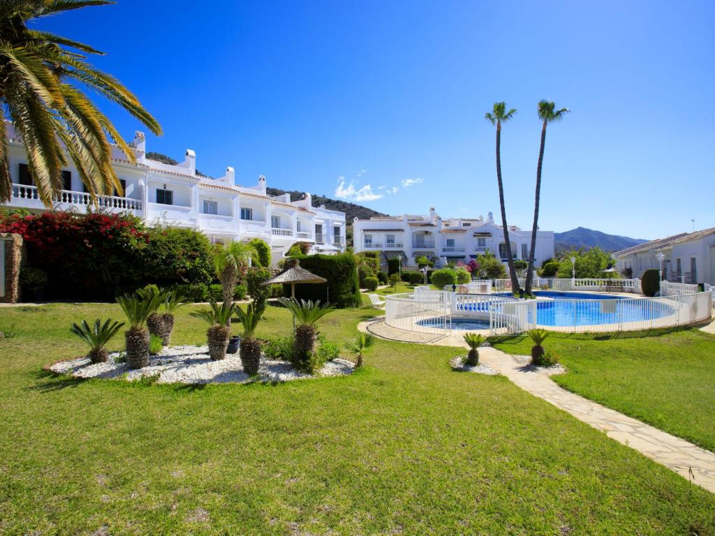 The swimming pool at or close to Holiday Home Jardines de Nerja by Interhome