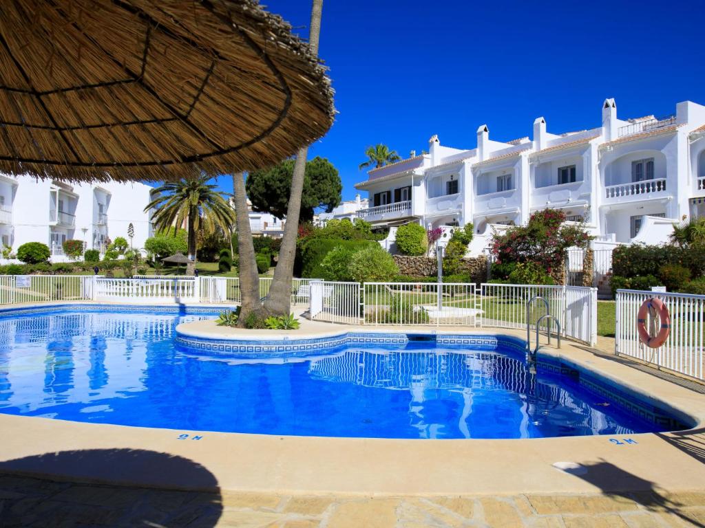 The swimming pool at or close to Holiday Home Jardines de Nerja by Interhome