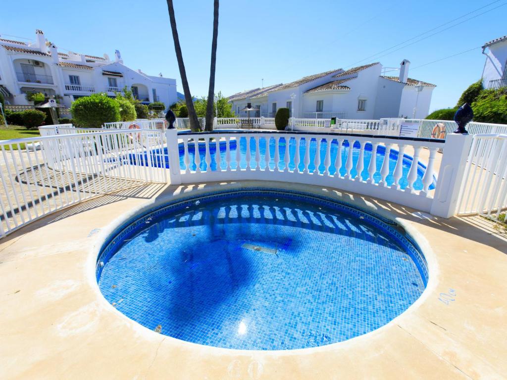 The swimming pool at or close to Holiday Home Jardines de Nerja by Interhome