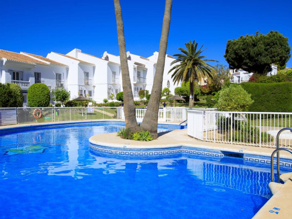 The swimming pool at or close to Holiday Home Jardines de Nerja by Interhome