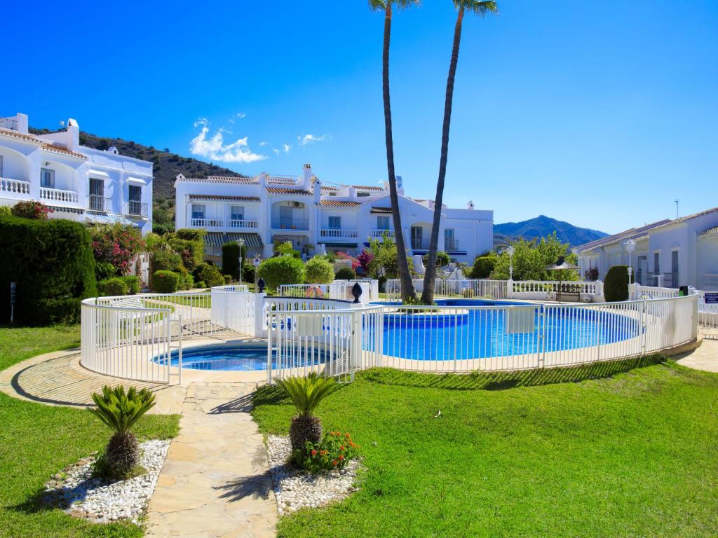 The swimming pool at or close to Holiday Home Jardines de Nerja by Interhome