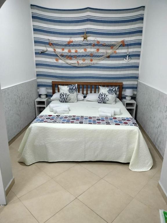 Posteľ alebo postele v izbe v ubytovaní Domus Rosaliae - Casa Vacanze