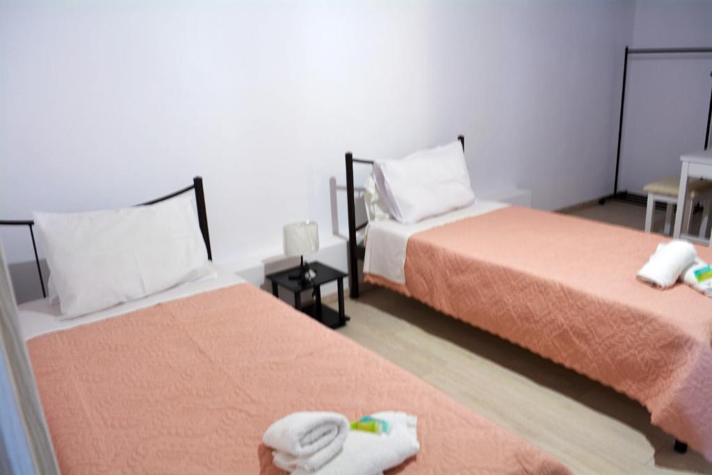 Postel nebo postele na pokoji v ubytování Tsaki seaview apartment