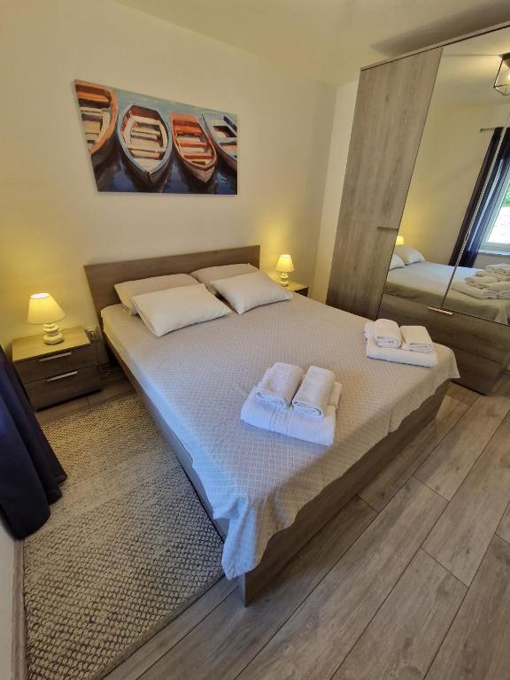 Postel nebo postele na pokoji v ubytování Apartman Kalinić