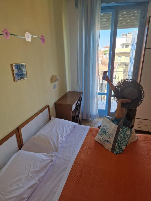 Postel nebo postele na pokoji v ubytování Hotel Clara RIMINI