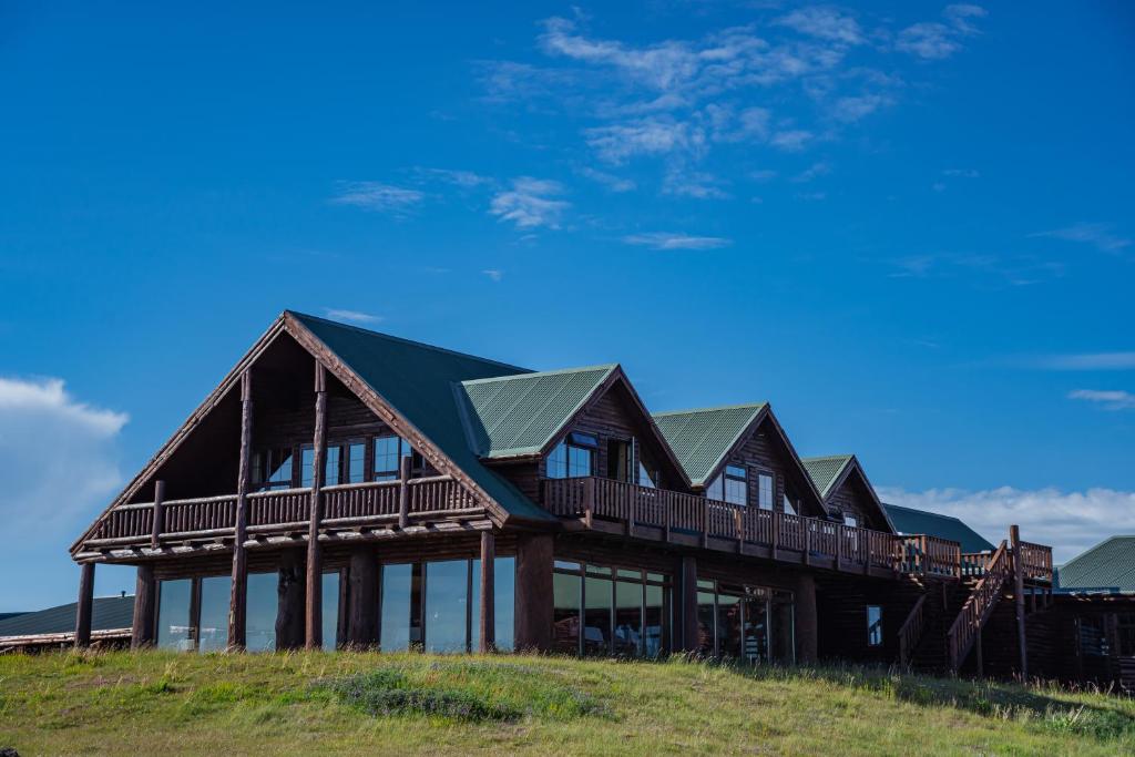 a large wooden house on top of a hill at Hotel Rangá in Hella