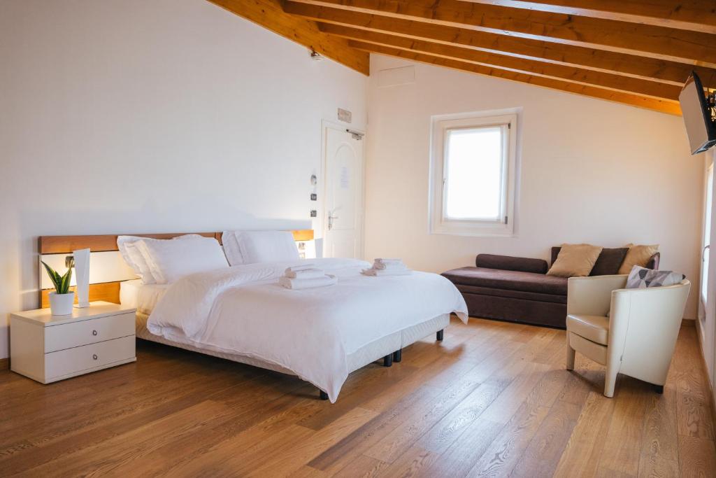 Łóżko lub łóżka w pokoju w obiekcie B&B Podere Dell'Angelo