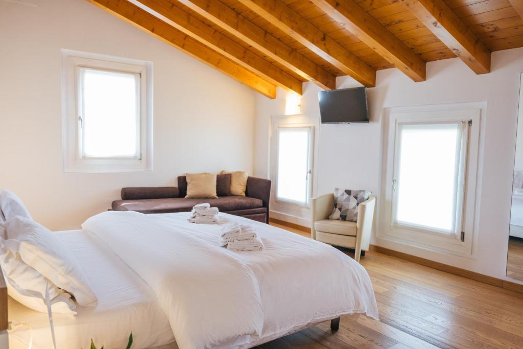 Łóżko lub łóżka w pokoju w obiekcie B&B Podere Dell'Angelo