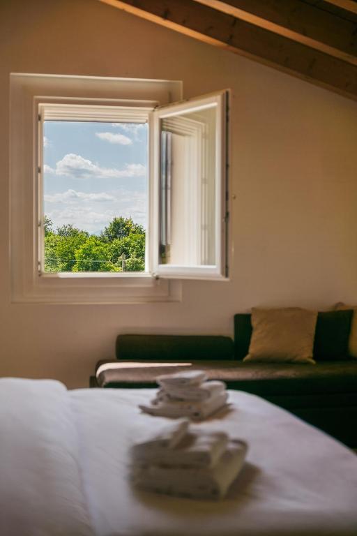 Łóżko lub łóżka w pokoju w obiekcie B&B Podere Dell'Angelo