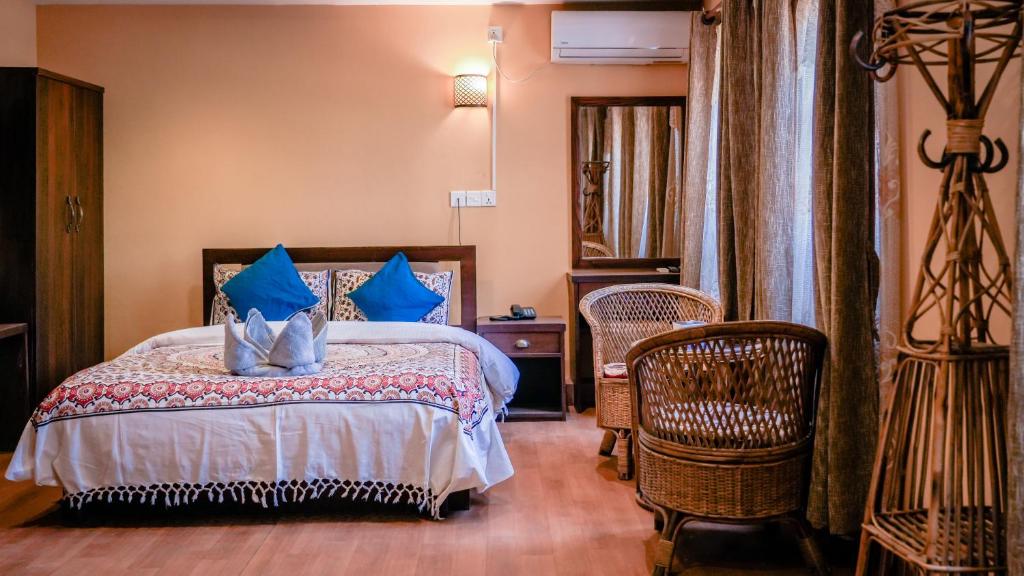 Postel nebo postele na pokoji v ubytování Hong Si Hotel- A Home Away from Home