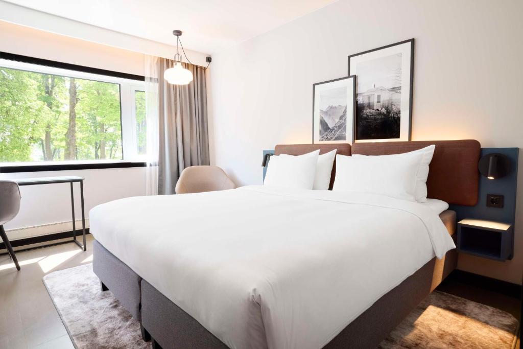 Postel nebo postele na pokoji v ubytování Radisson Blu Park Hotel, Oslo