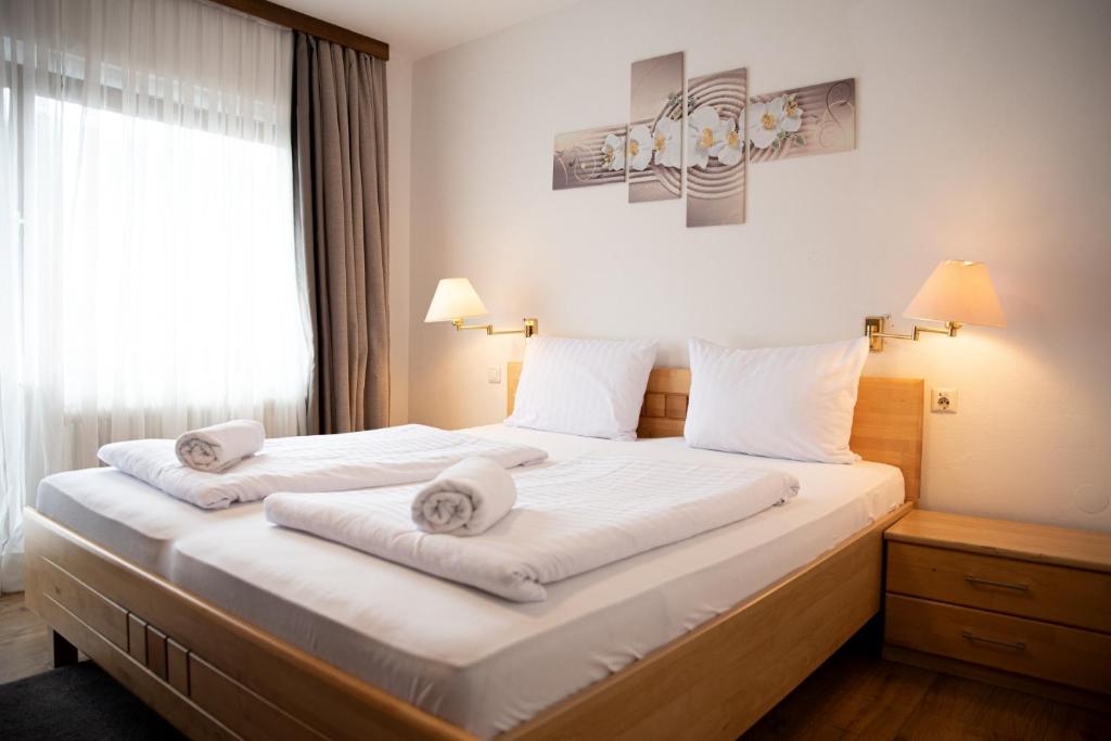 Postel nebo postele na pokoji v ubytování Haus Maria