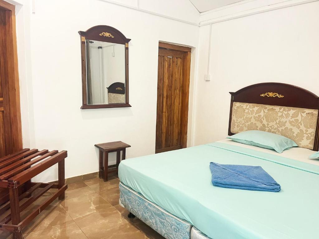 Postel nebo postele na pokoji v ubytování Tristar beach hotel