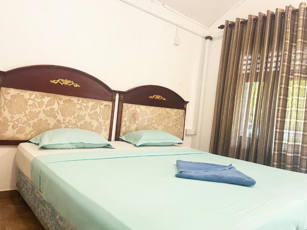 Postel nebo postele na pokoji v ubytování Tristar beach hotel
