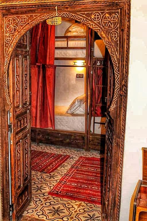 Postel nebo postele na pokoji v ubytování Hostel Dar Ben Youssef