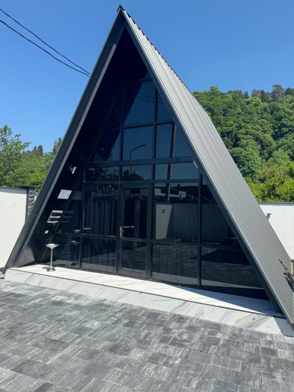 a triangle roof on top of a building at Villa Edelweiss in Batumi
