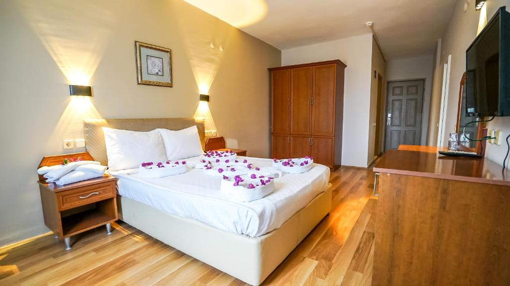 Postel nebo postele na pokoji v ubytování Nex Royal Beach Hotel- All Inclusive