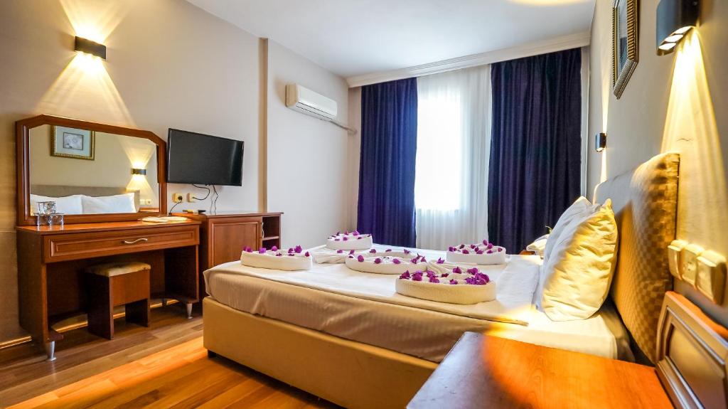 Postel nebo postele na pokoji v ubytování Nex Royal Beach Hotel- All Inclusive