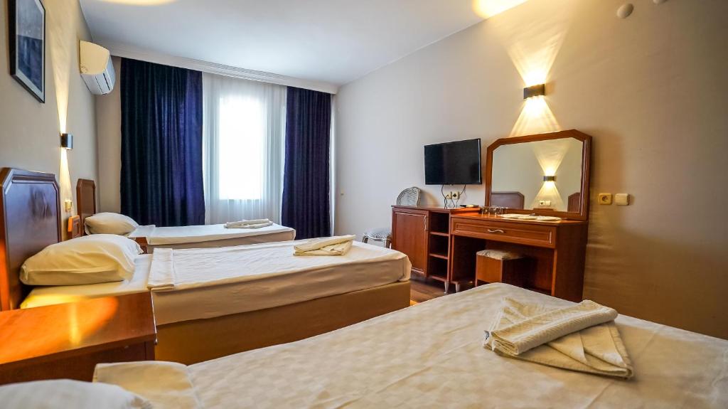 Postel nebo postele na pokoji v ubytování Nex Royal Beach Hotel- All Inclusive