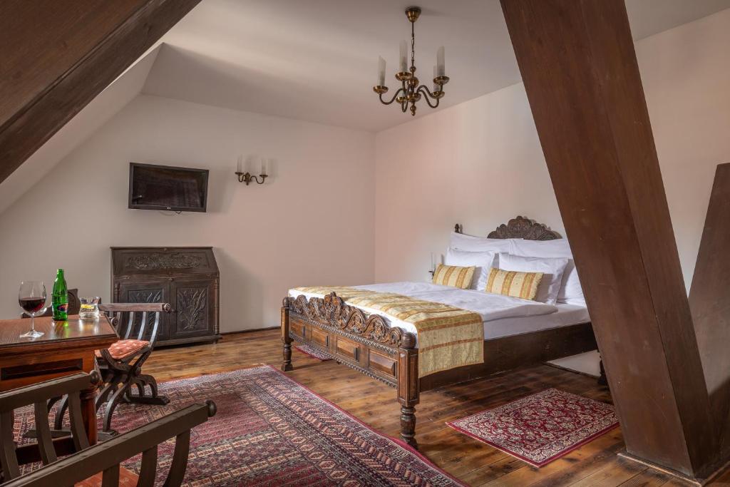 Postel nebo postele na pokoji v ubytování Hotel Ruze