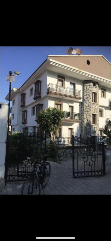 a building with a bike parked in front of it at Çeşme Suites in Çeşme