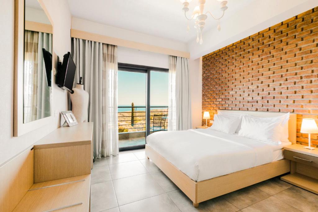 Postel nebo postele na pokoji v ubytování My Suite Boutique Hotel