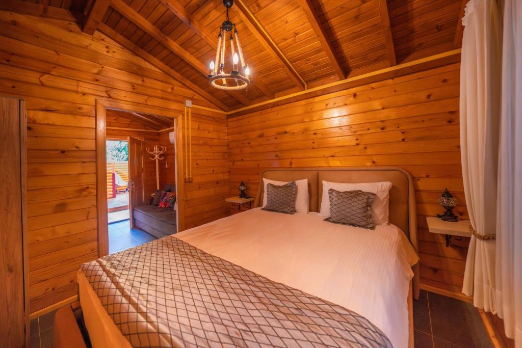 A bed or beds in a room at Alfa Suites & SPA