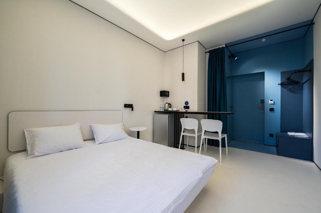 Кровать или кровати в номере Ultramarinn Hotel