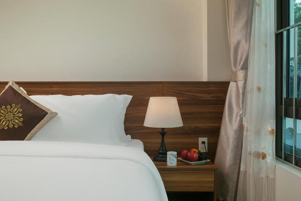 Postel nebo postele na pokoji v ubytování DUNG LAI HOTEL 173
