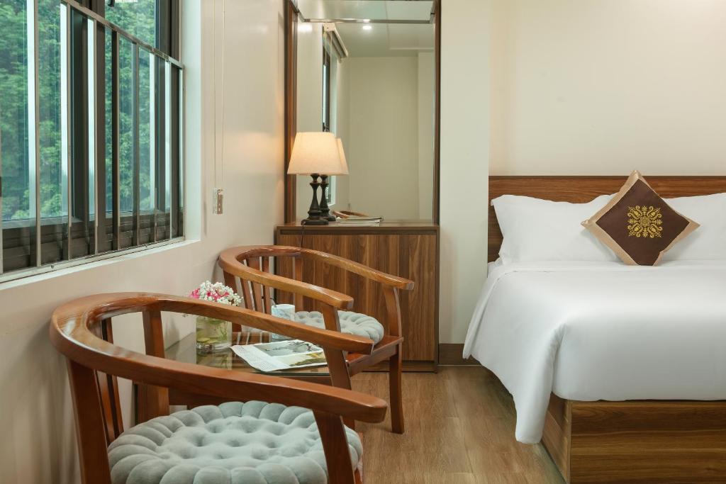 Postel nebo postele na pokoji v ubytování DUNG LAI HOTEL 173