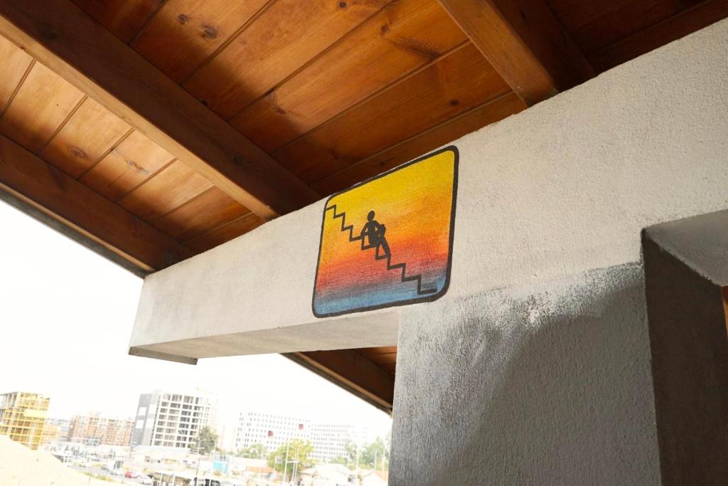 a sign on the side of a building at Divina Hostel in Tirana