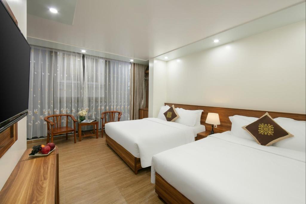 Postel nebo postele na pokoji v ubytování DUNG LAI HOTEL 173