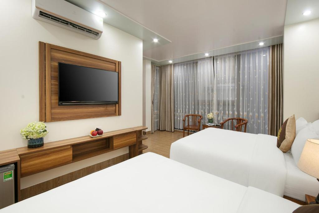 Postel nebo postele na pokoji v ubytování DUNG LAI HOTEL 173