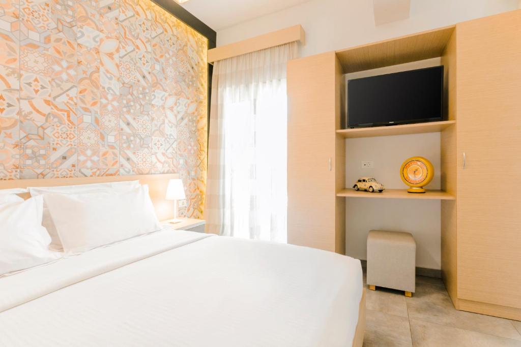 Postel nebo postele na pokoji v ubytování My Suite Boutique Hotel