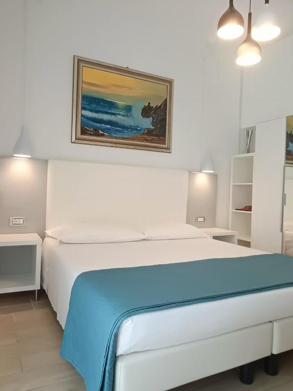 Łóżko lub łóżka w pokoju w obiekcie Hotel Merano
