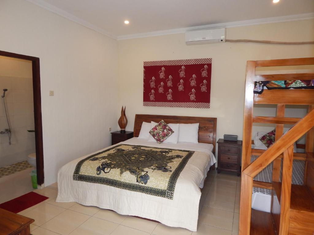 Postel nebo postele na pokoji v ubytování Rosella Cottages - Homestay - Yogyakarta