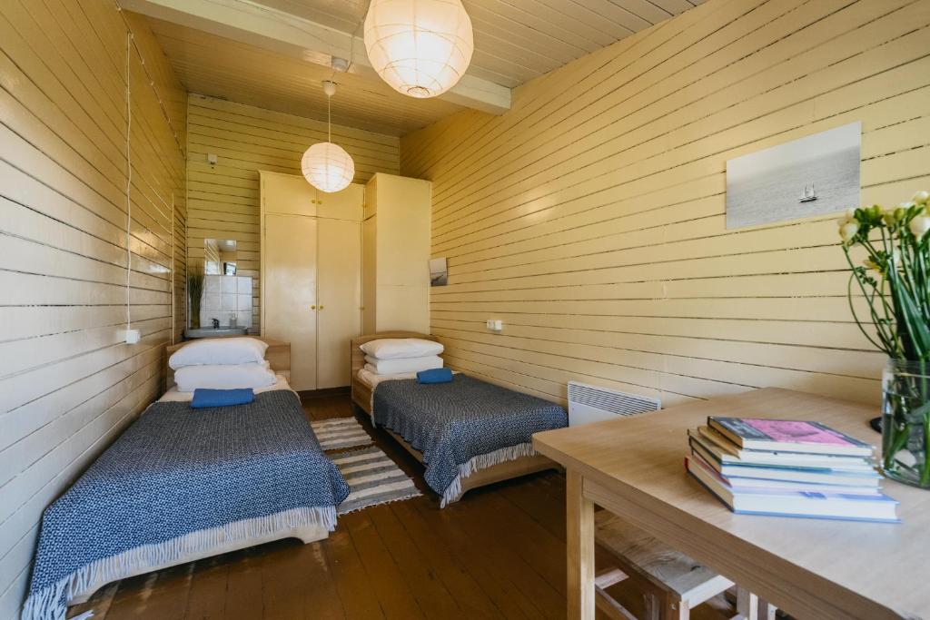 Postel nebo postele na pokoji v ubytování Kastytis