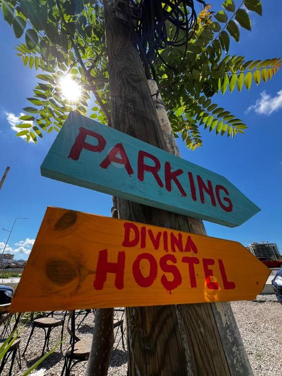 a sign that says parking and driving hospital at Divina Hostel in Tirana